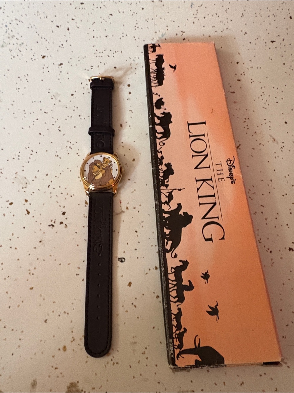 Disney Lion King Men's Black Strap Watch with Gold Case and Simba Dial